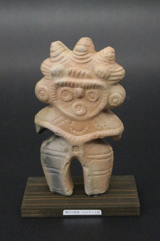 Eared owl clay figurine